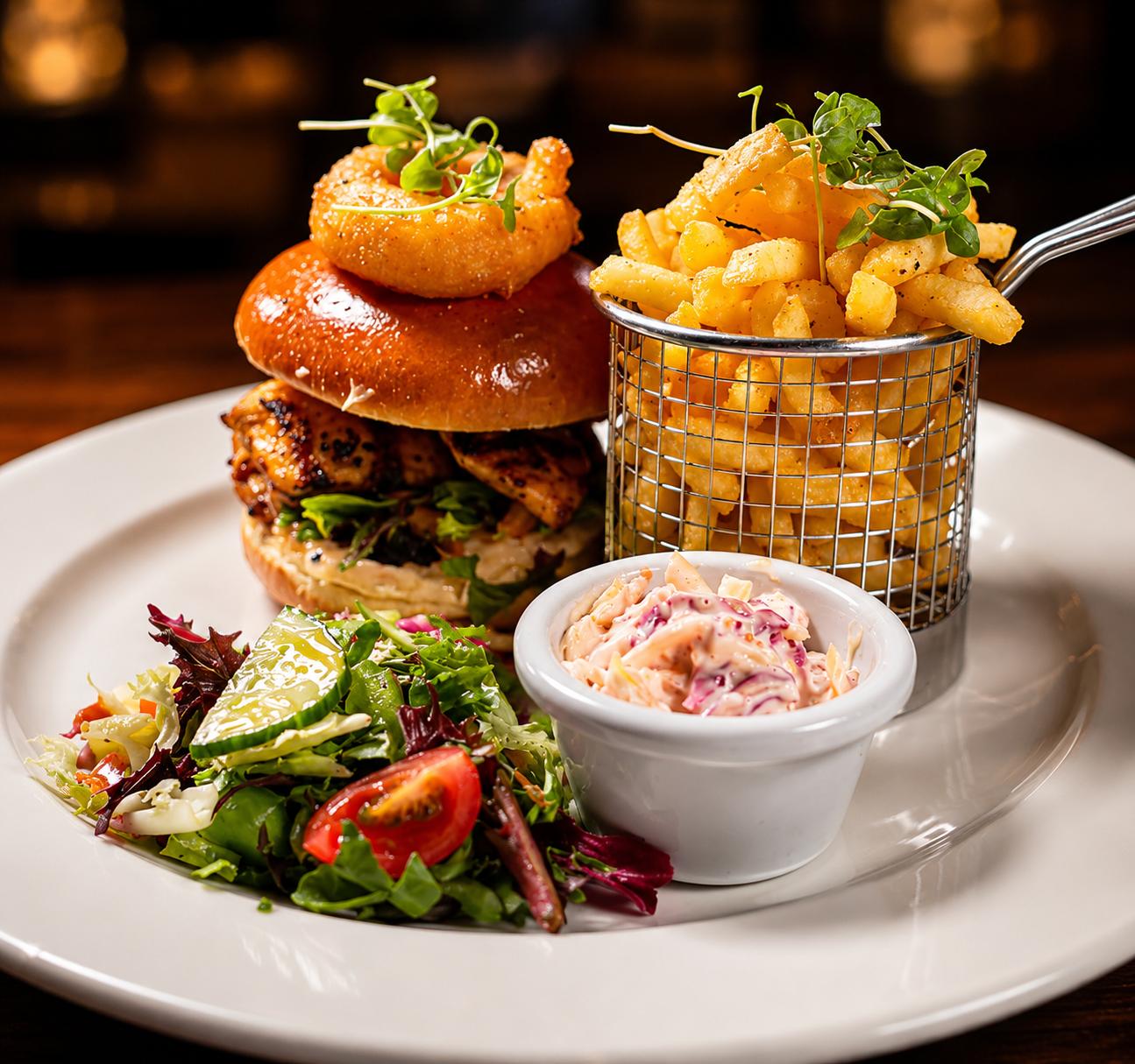 Burger, chips and salad served at The Gordon Arms